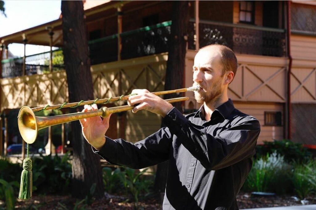 Dr Matthew Winnel, founder of ImpromptuAI, playing trumpet